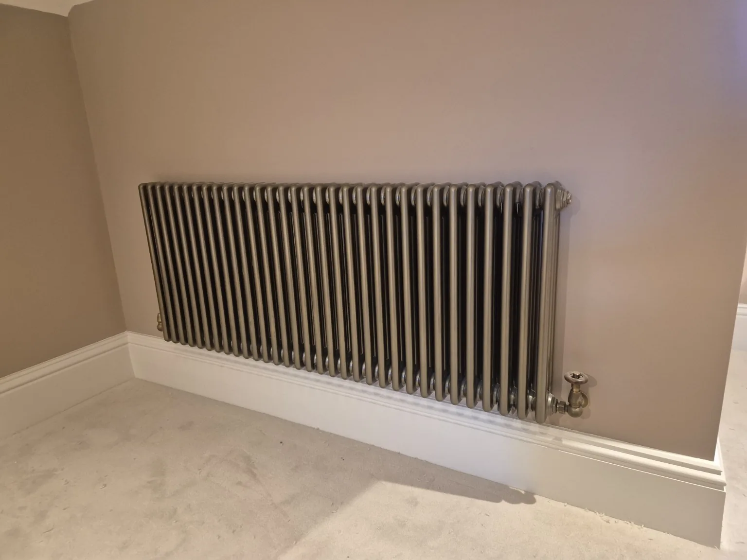 Traditional column radiator by Farrell Plumbing