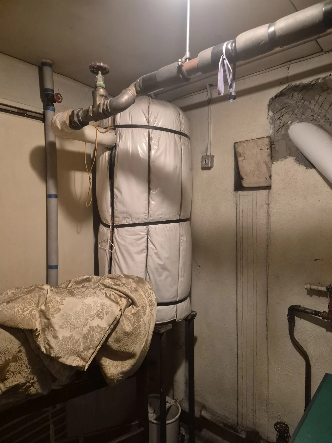 Old hot-water cylinder before upgrade by Farrell Plumbing