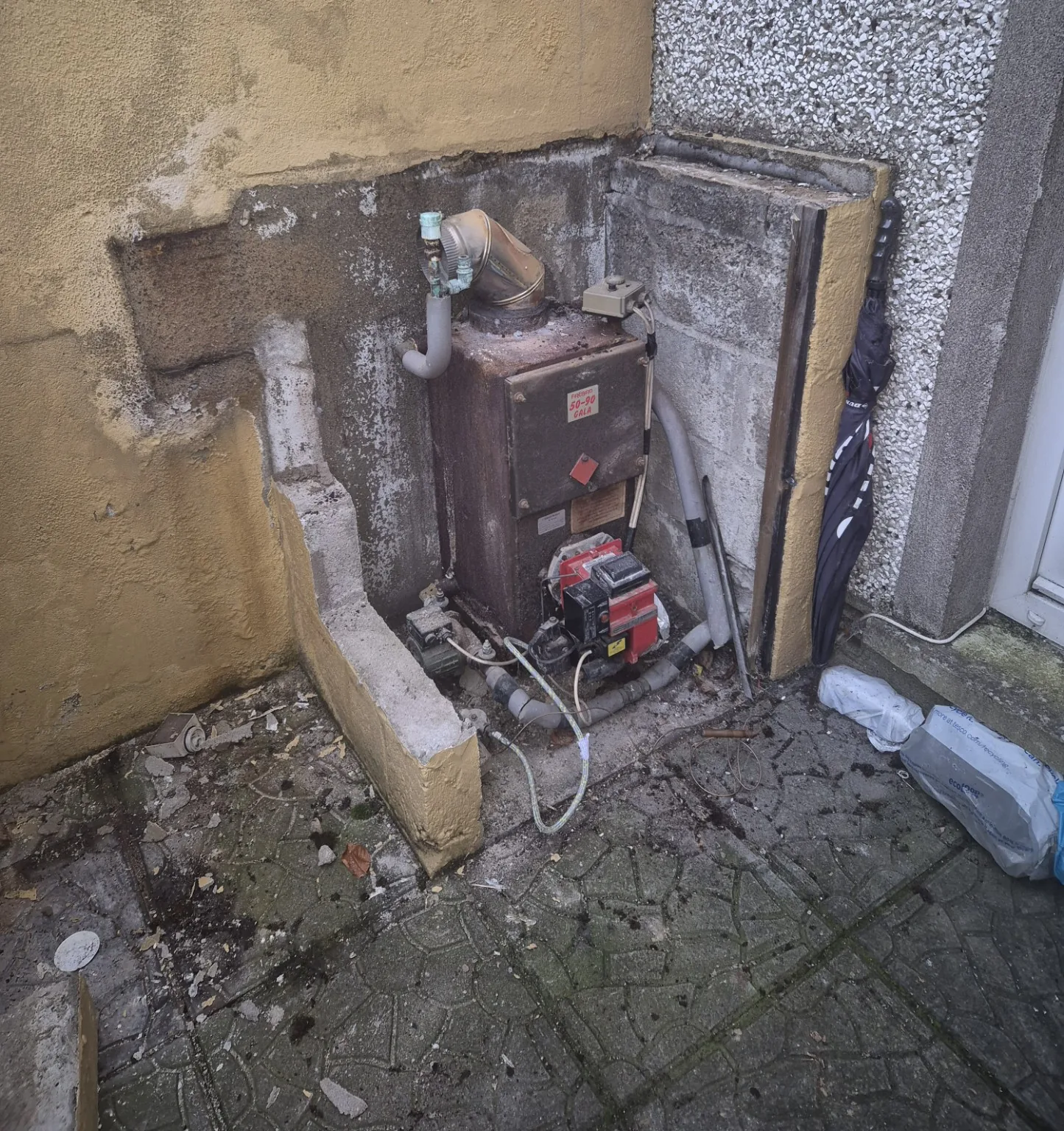 Old oil boiler before replacement by Farrell Plumbing
