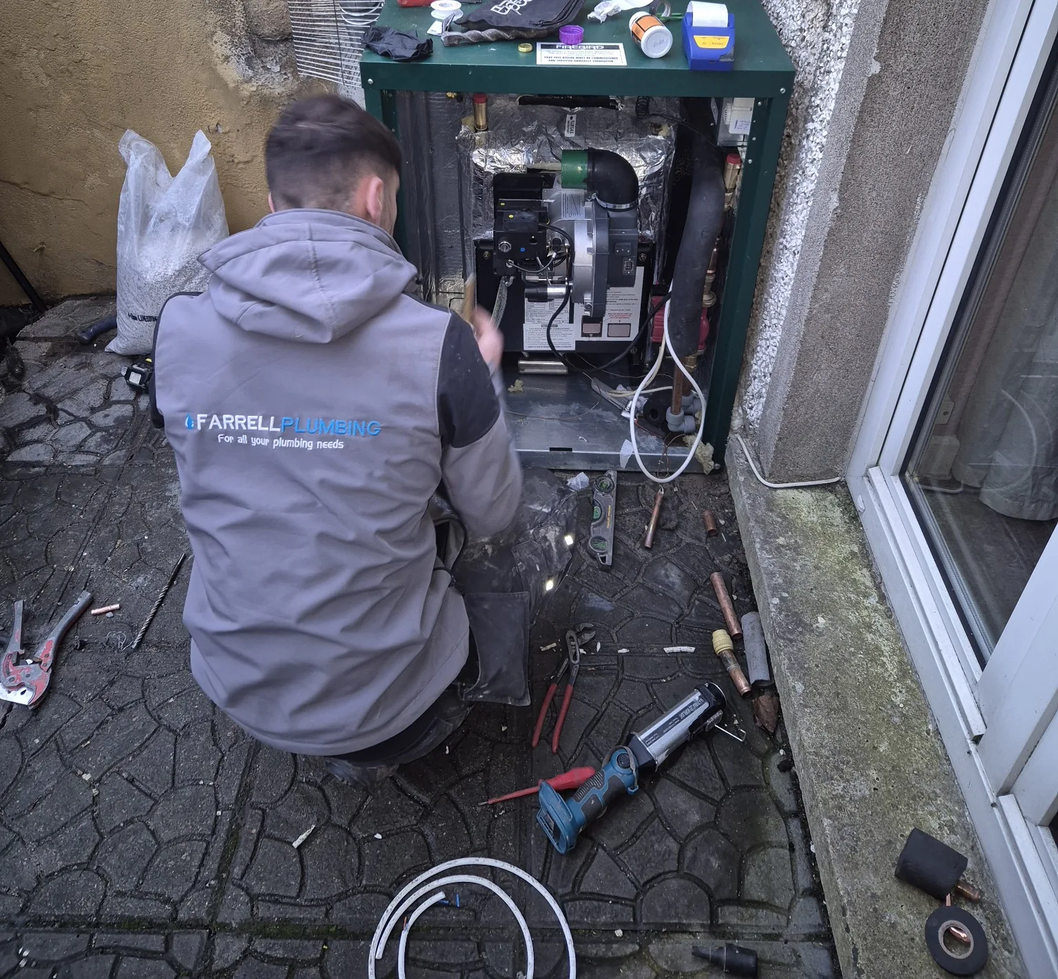 Firebird oil boiler installation in progress by Farrell Plumbing